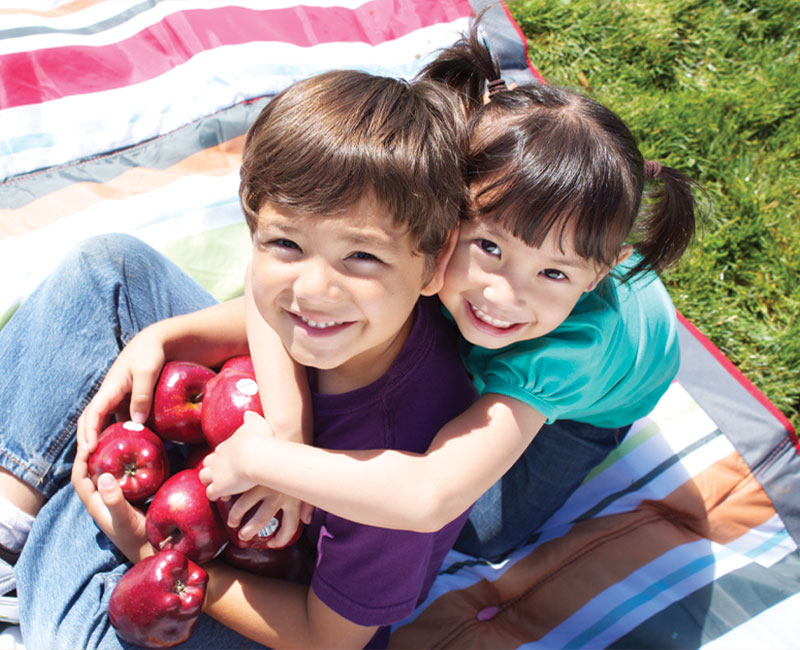 boy and girl with apples